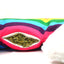 Close-up of the cat toy’s refillable pocket, showing loose catnip inside a zippered opening on the rainbow fabric.